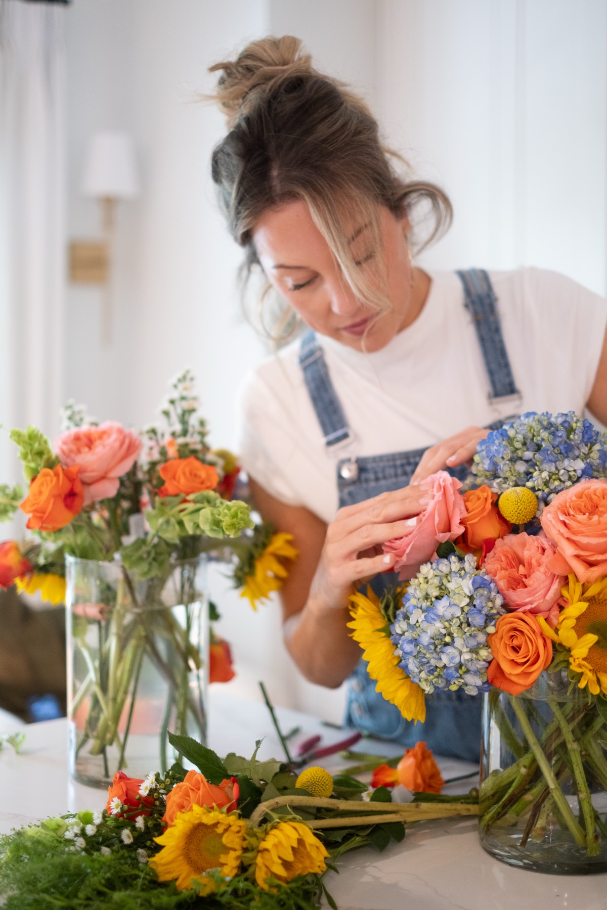 Florist arranging colorful bouquets on table