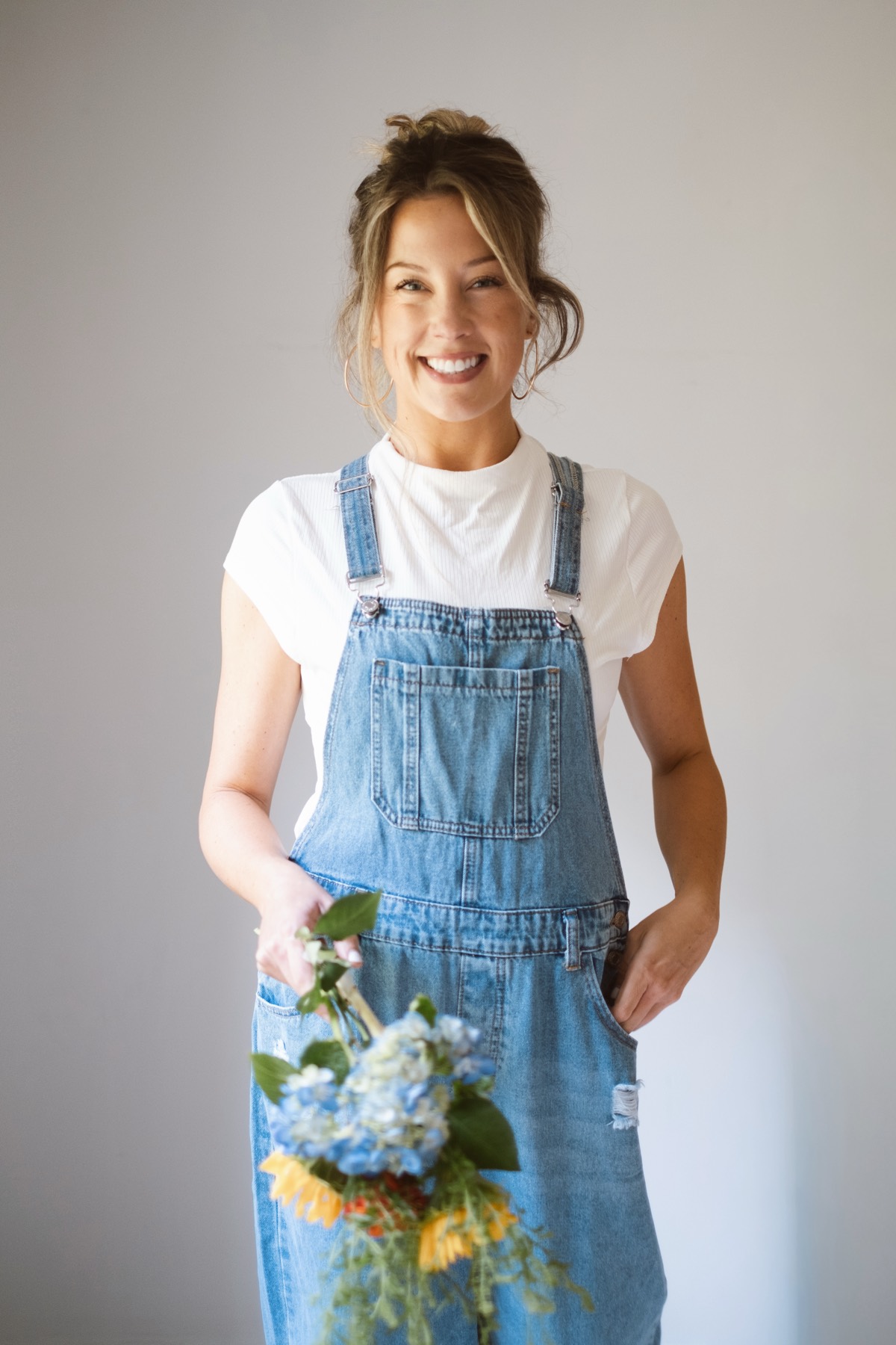 Sunday House florist smiling in studio